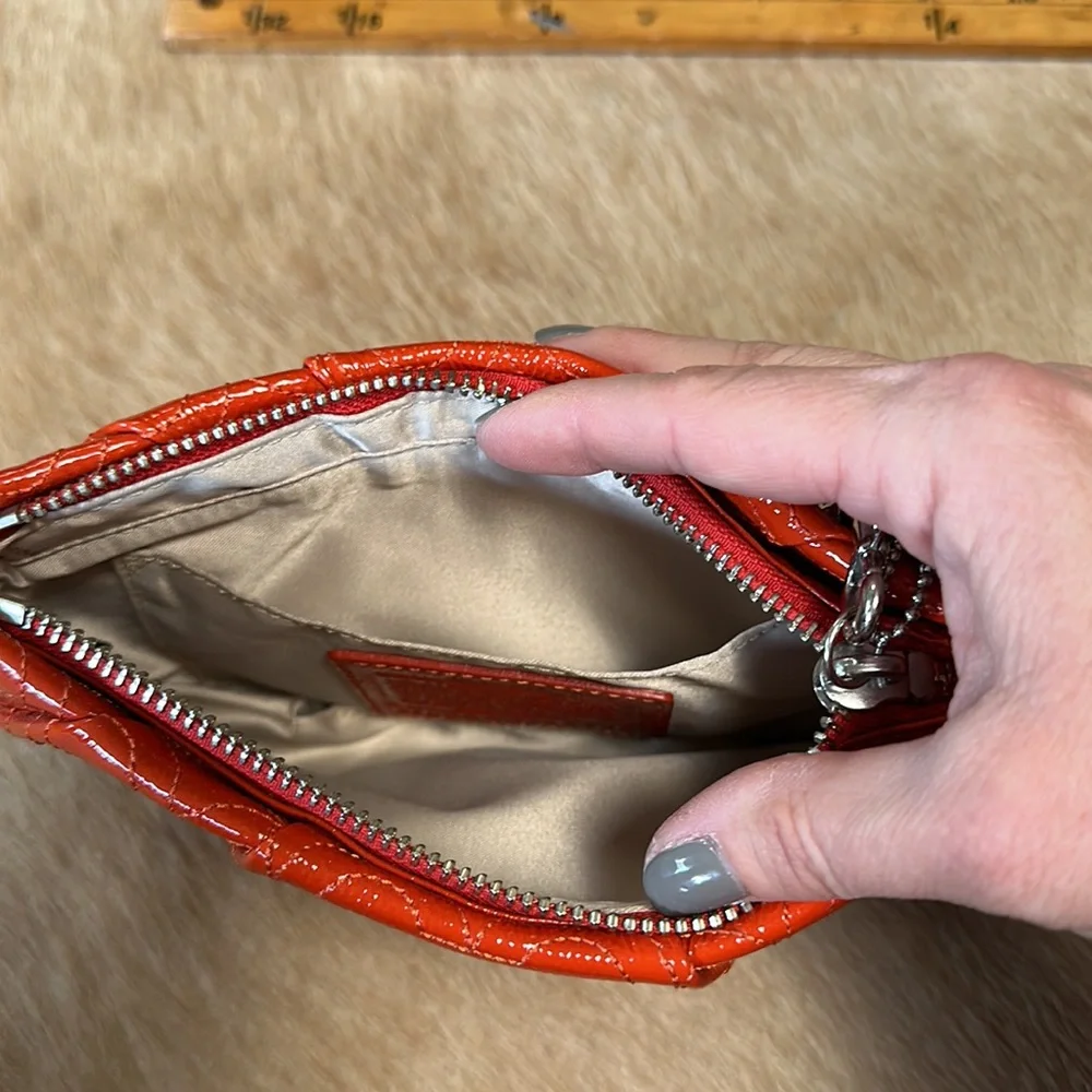 Coach - orange patent wristlet